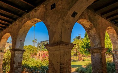 San Juan Capistrano, USA - August 6, 2023: Historic ruins of Mission San Juan Capistrano California, architectural details of the Spanish Colonial era clipart