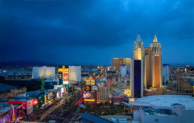 Las Vegas, Nevada, USA - October 25, 2021: The Strip skyline with advertising billboards, neon lights on iconic hotels and casinos after sunset clipart