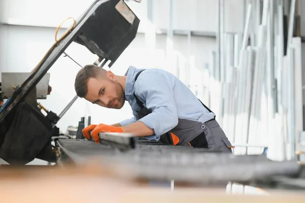 stock image Smart factory worker or engineer do machine job in manufacturing workshop . Industry and engineering concept