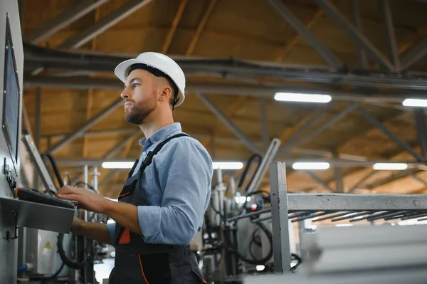 stock image Smart factory worker or engineer do machine job in manufacturing workshop . Industry and engineering concept