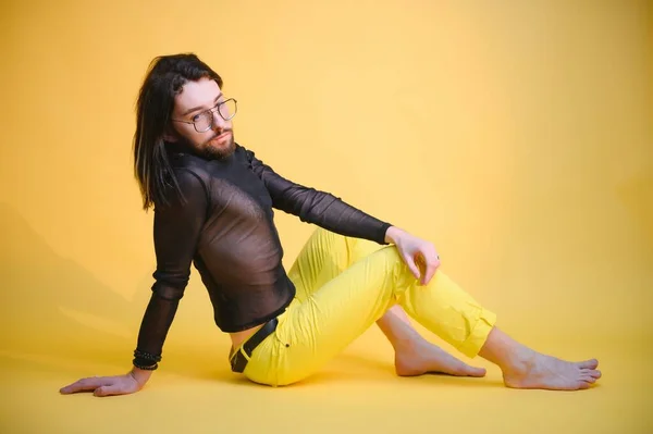 stock image Young, handsome gay man on a colored background in the studio. LGBT concept