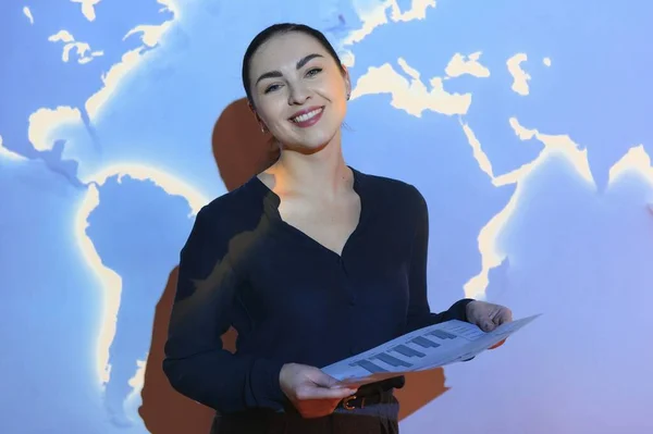 Globe business concept - happy business woman with world map background