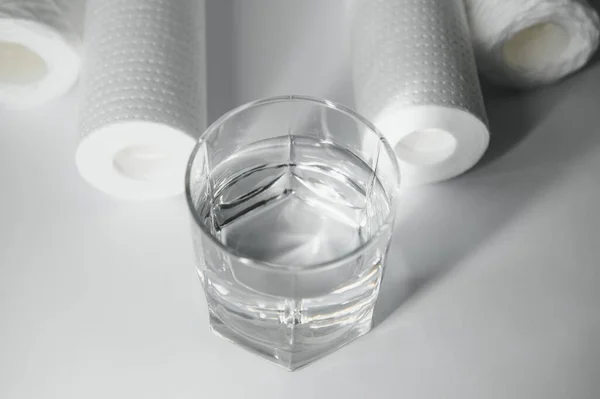 filter cartridges for water on a white background. Installation of reverse osmosis water purification system