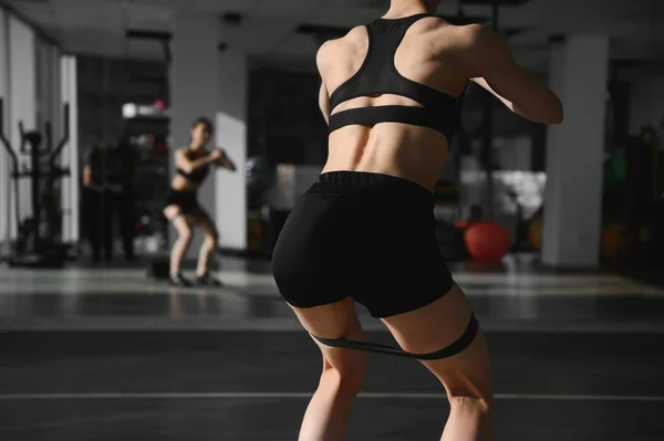 Motivation Girls Modern Young Woman Sport Clothing Crouching Using Resistance — Stockfoto