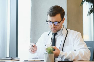 Portrait of a serious doctor in medical office