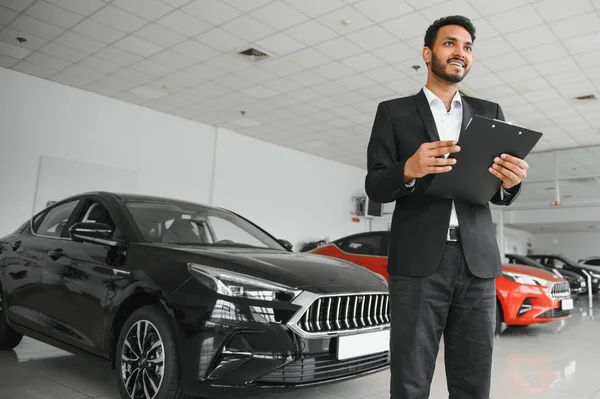 Good Looking Cheerful Friendly Indian Salesman Poses Car Salon Showroom — Foto de Stock
