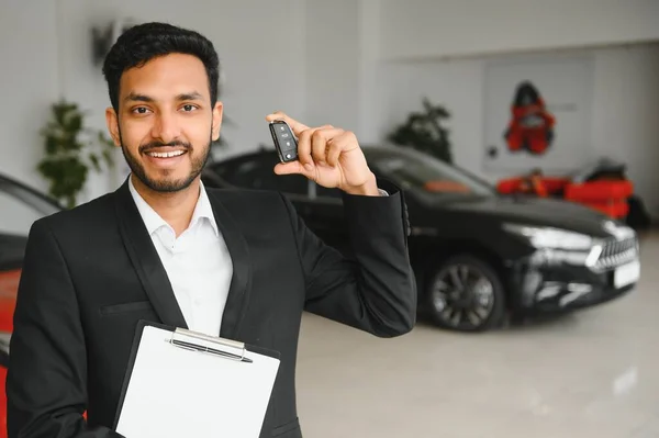 Indian Cheerful Car Salesman Showing New Car Showroom — Stock Photo, Image