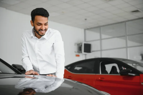 Happy Indian Man Checking Car Features Showroom — Stock Photo, Image