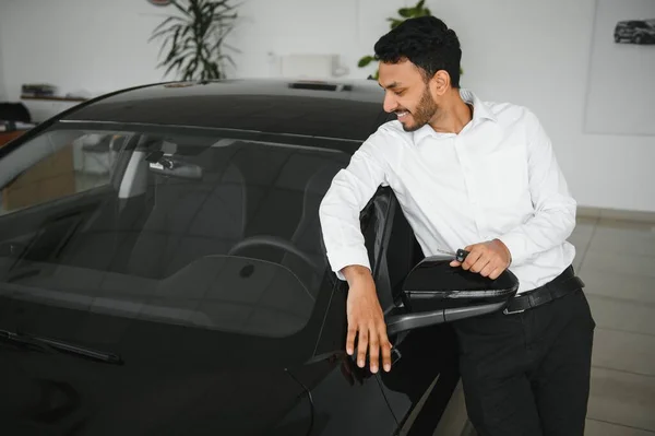 Happy Indian Man Checking Car Features Showroom — Stock Fotó