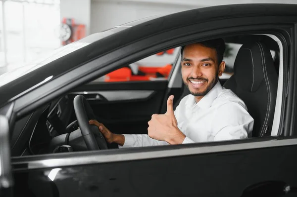 Happy Indian Man Checking Car Features Showroom — Foto de Stock