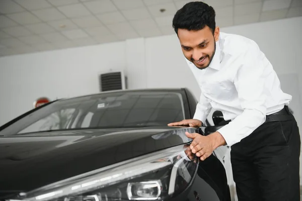 Happy Indian Man Checking Car Features Showroom —  Fotos de Stock