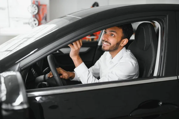 Young Man Sitting New Car Smiling — Stockfoto