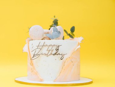 Cake on birthday on a yellow background