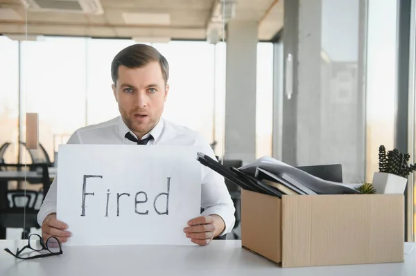 Sad Fired Let Office Worker Packs His Belongings Cardboard Box — Zdjęcie stockowe