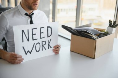 Close-up Of A Businessperson Carrying Cardboard Box During Office Meeting.