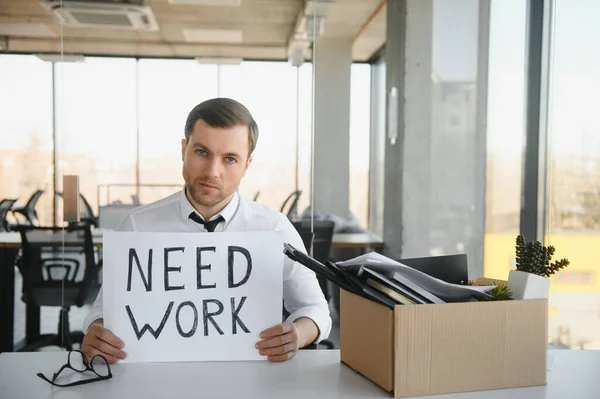 stock image Professional looking for a job. Photo of unhappy worker mature guy financial crisis lost work hold carton placard banner search work place moody wear suit.