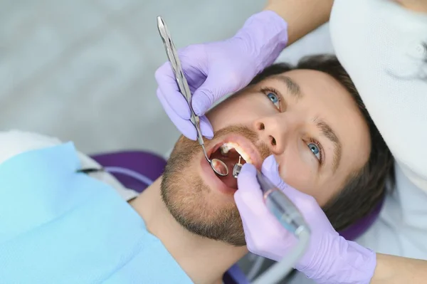 stock image Man having teeth examined at dentists.