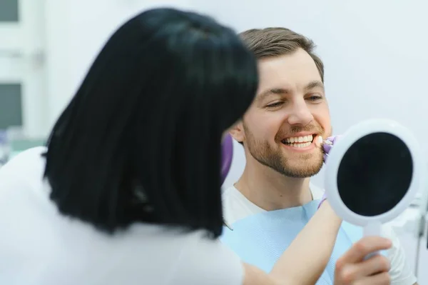 stock image Dental care concept. Handsome young guy at the dentist's office