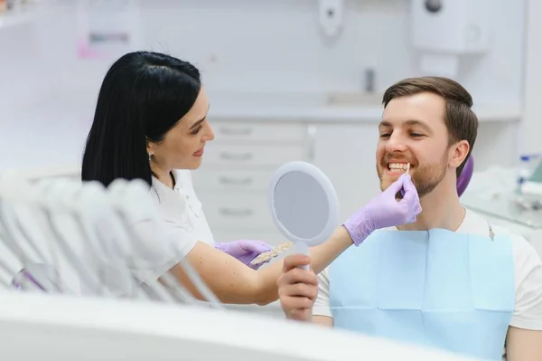 stock image Dental care concept. Handsome young guy at the dentist's office