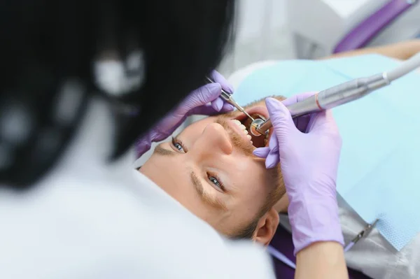 stock image Dental care concept. Handsome young guy at the dentist's office