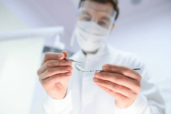 stock image Young male dentist in clinic.