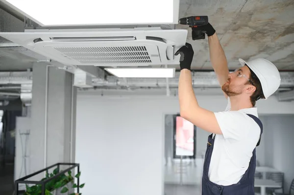 Happy Male Technician Repairing Air Conditioner — Stock Photo, Image
