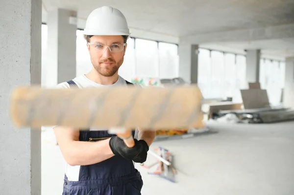 stock image A happy worker proudly standing at his workplace