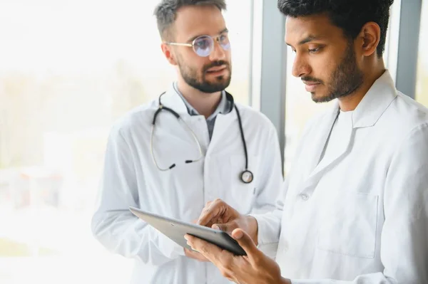 stock image Two young male doctors in the clinic.