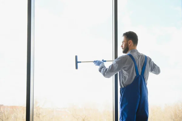 Young Man Cleaning Window Office — Stock Photo, Image
