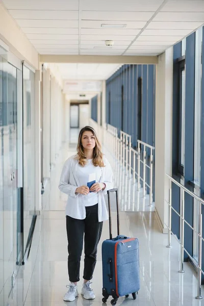 stock image Pretty young female passenger at the airport.