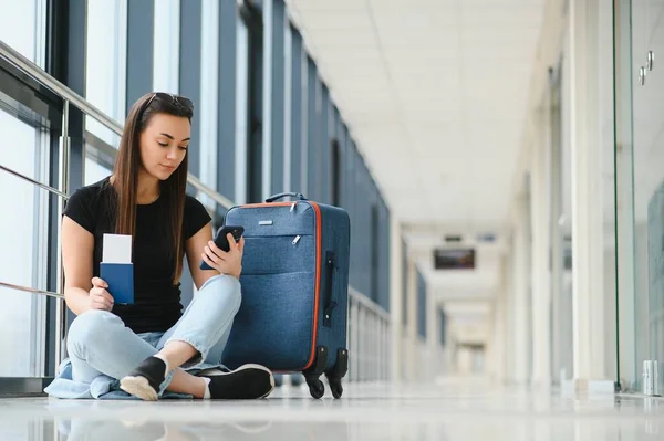 stock image Girl at the airport window.