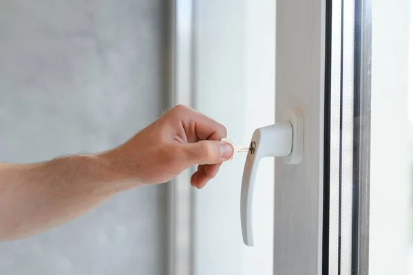stock image Window handle lock. Key locking window with key for kids safety. Window Restrictors in the home