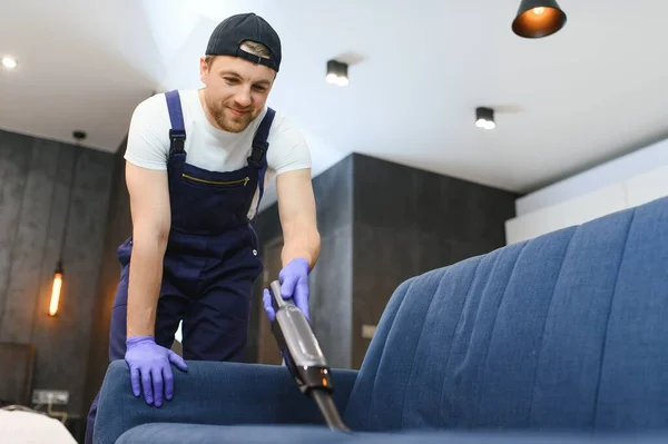 Cleaning Service Man Janitor Gloves Uniform Vacuum Clean Sofa Professional — Stock Photo, Image