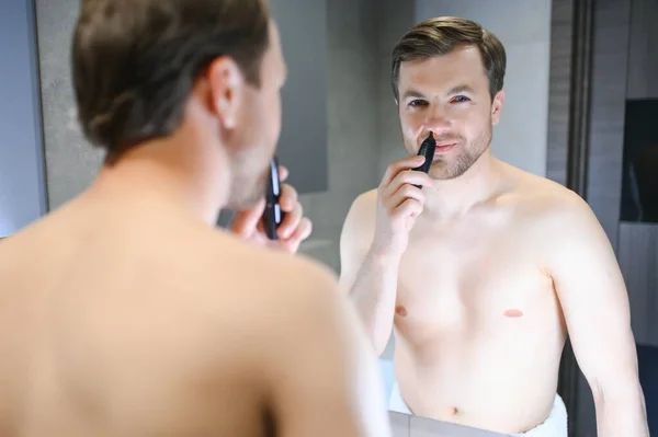 Handsome Young Man Remove Hair His Nose Trimmer — Stock Photo, Image
