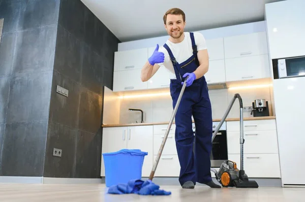 Professional Cleaner Blue Uniform Washing Floor Wiping Dust Furniture Living — Stock Photo, Image