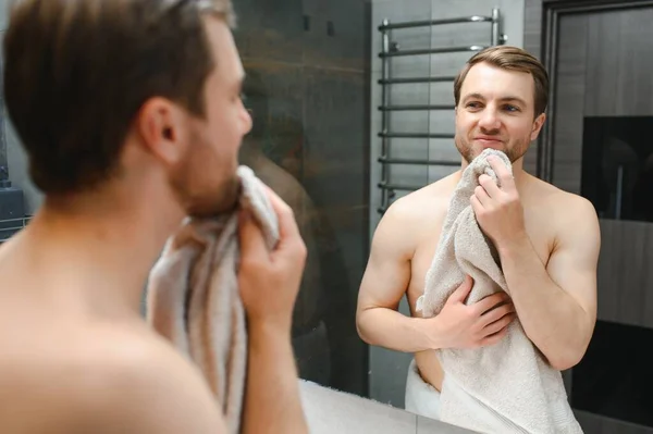 Young Caucasian Man Look Mirror Skincare Facial Routine Shower Home — Stockfoto