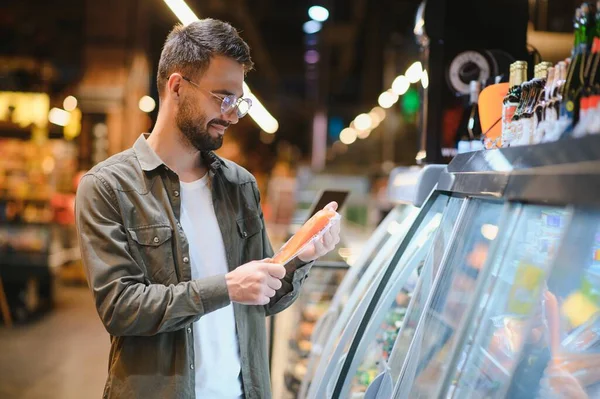 stock image Handsome man shopping in a supermarket.