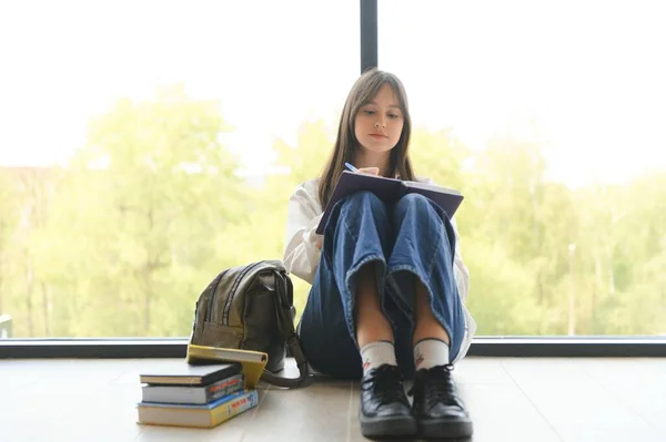 Girl Smiling Beautiful Schoolgirl Smiling While Sitting Window Reading Book — Stock Photo, Image
