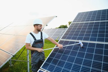 man cleaning, solar power washing.