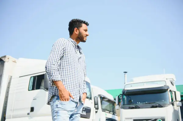 Stock image Young indian man standing by his truck. The concept of freight transportation