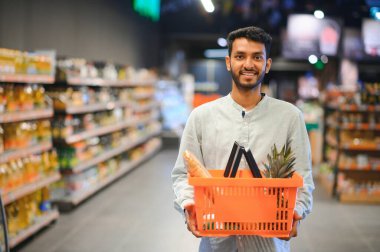 Man at grocery store products.