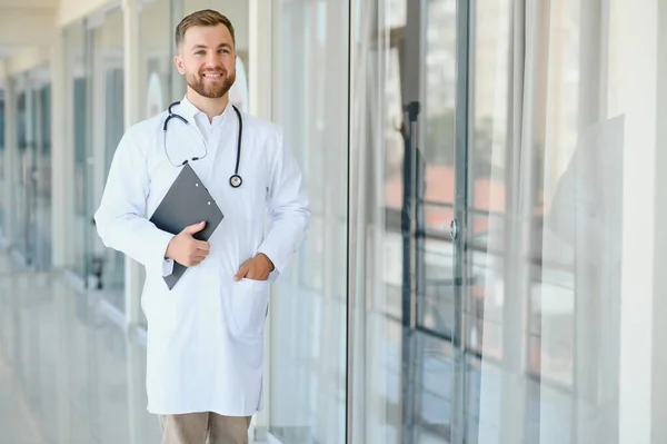 Young male doctor in a corridor of a general hospital.