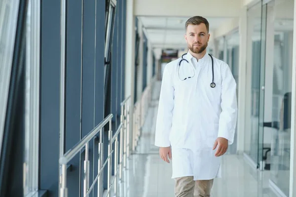 Young male doctor in a corridor of a general hospital.