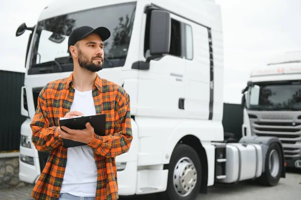 Men driver near lorry truck. Man owner truck driver near truck. Man trucker trucking owner. Transportation industry vehicles. Handsome man driver front of truck