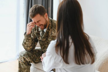 Psychologist supporting military officer in office, closeup