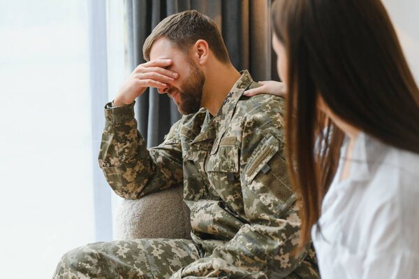 Army anger, ptsd and man in therapy with stress from war and a psychologist for support.