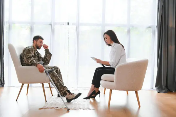 Psychologist supporting military officer in office, closeup
