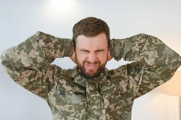 Military veteran with post traumatic stress disorder screaming at home.