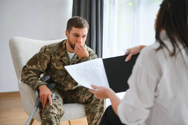 Psychologist supporting military officer in office, closeup