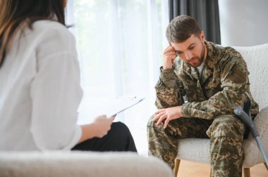 Psychologist supporting military officer in office, closeup